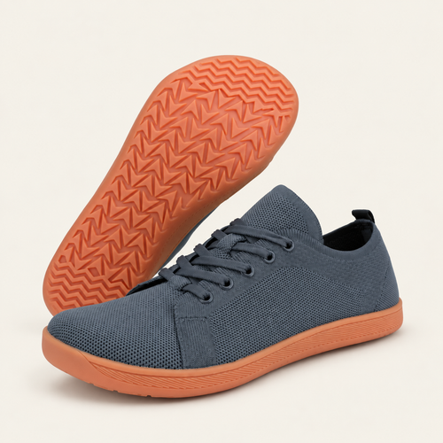 Carrera Aire™ — Gris con suela naranja, fondo crema